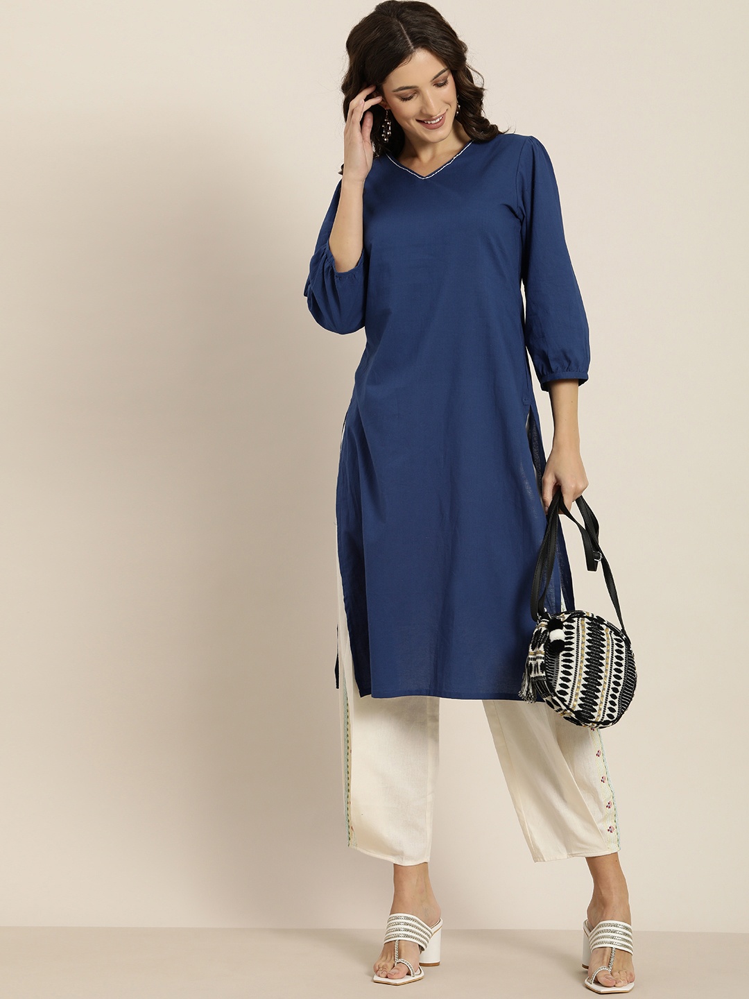 

Moda Rapido Women Navy Blue Solid Pure Cotton Kurta with Puff Sleeves