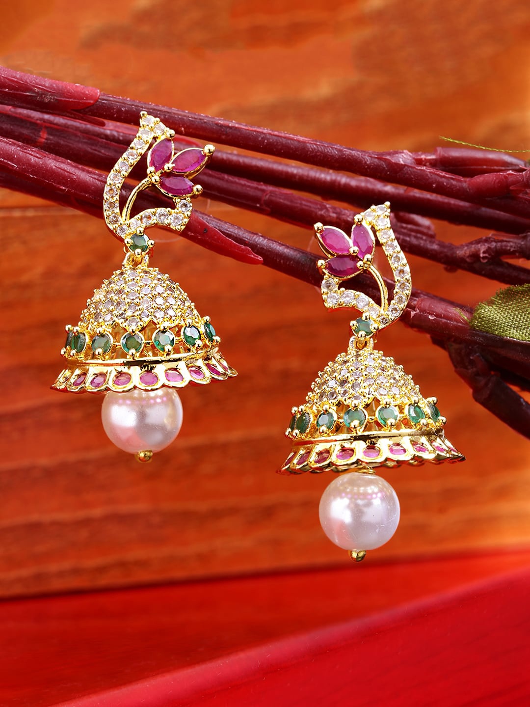 

Yellow Chimes Gold-Toned & Pink Peacock Shaped Jhumkas Earrings