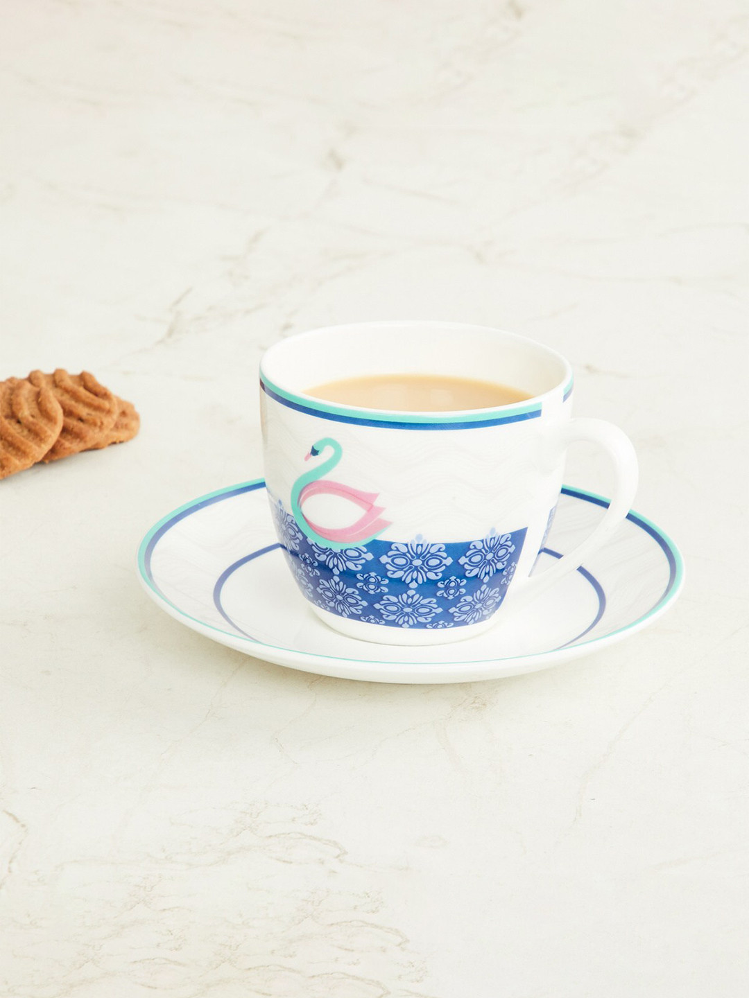 

Home Centre White & Blue Printed Bone China Glossy Cups and Saucers Set of Cups and Mugs