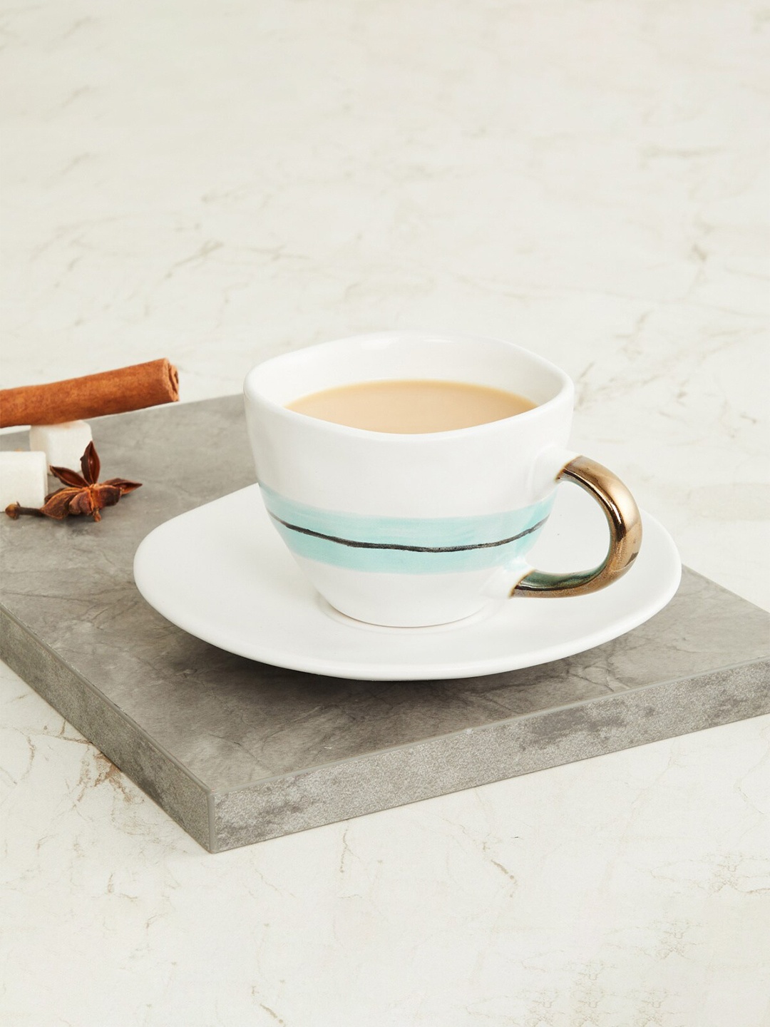 

Home Centre 2 Pieces Blue & White Printed Stoneware Matte Cup and Saucer Set