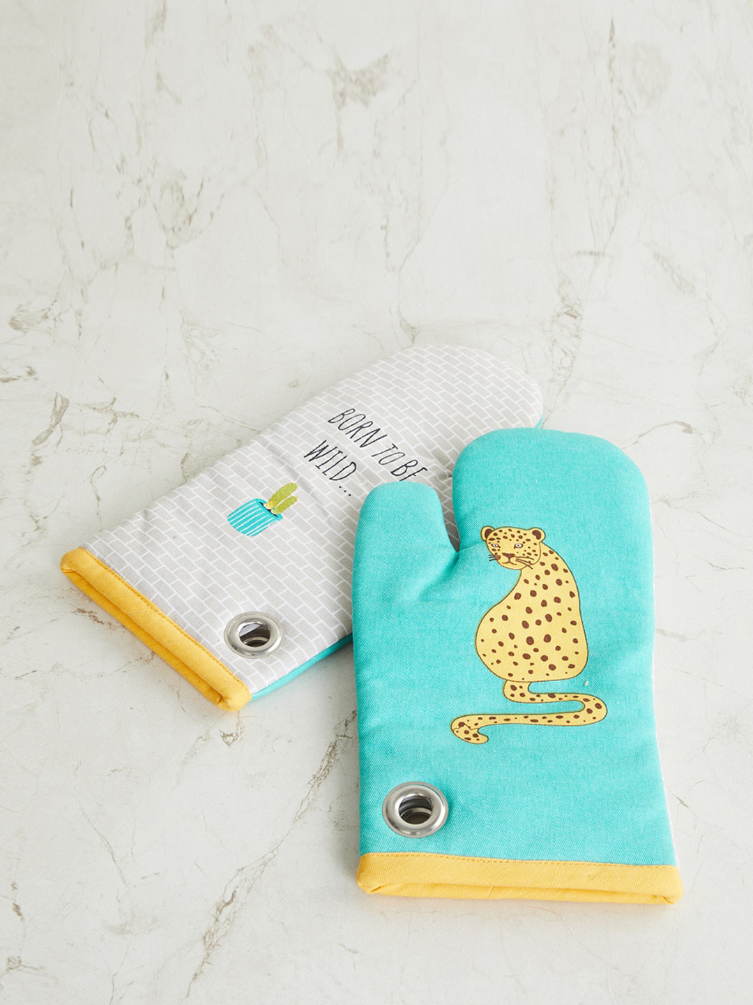 

Home Centre Teal Green Printed Cotton Oven Mittens