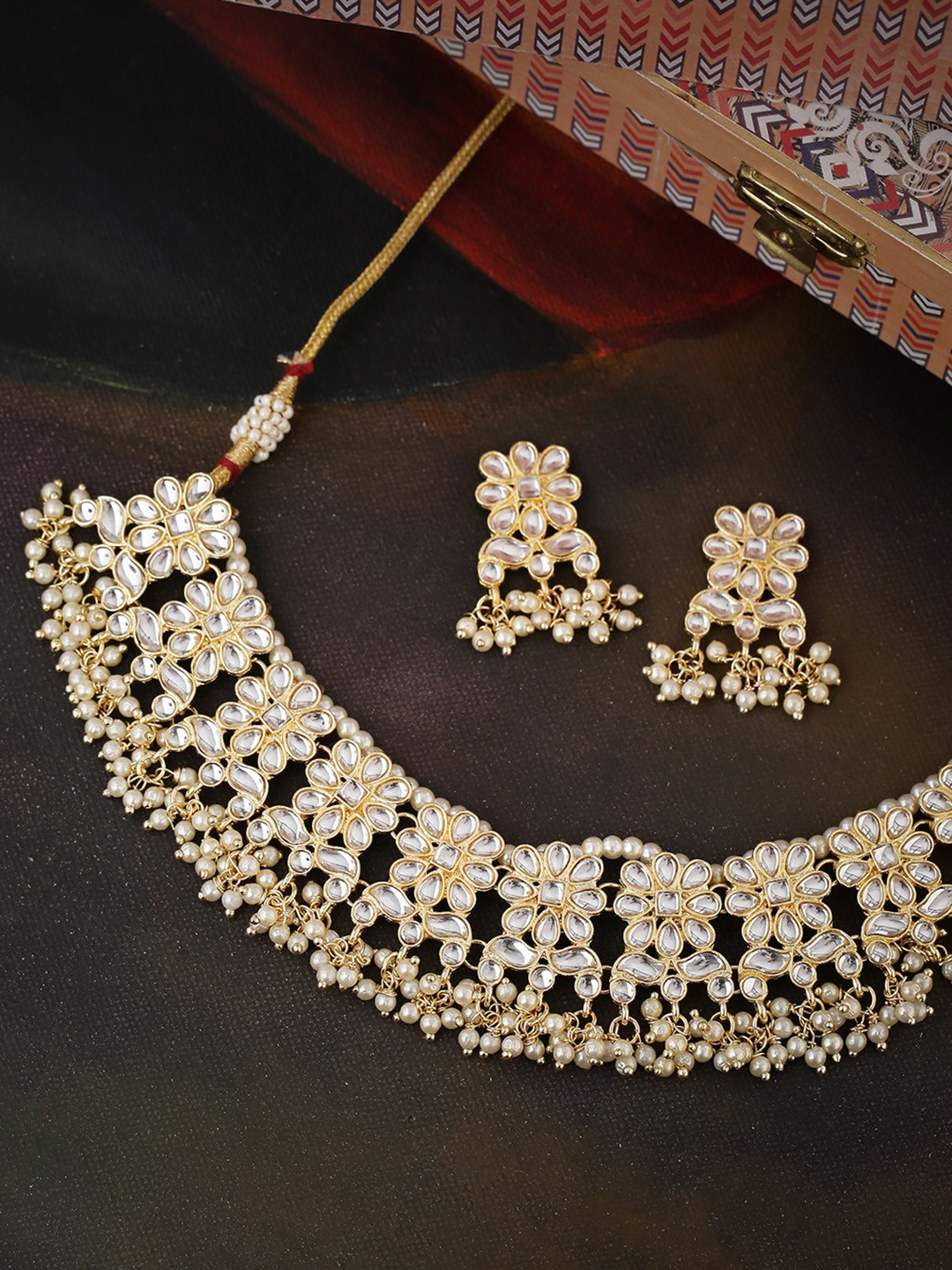 

Shoshaa Gold-Plated White Kundan-Studded & Beaded Handcrafted Jewellery Set