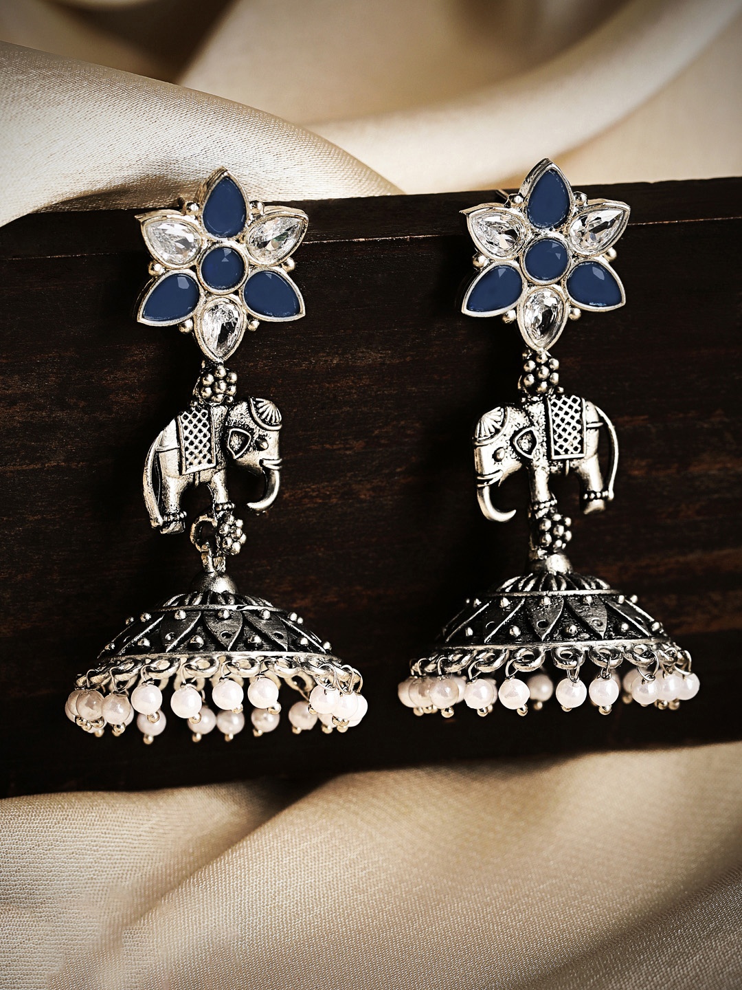 

Rubans Silver-Toned & Blue Dome Shaped Jhumkas Earrings