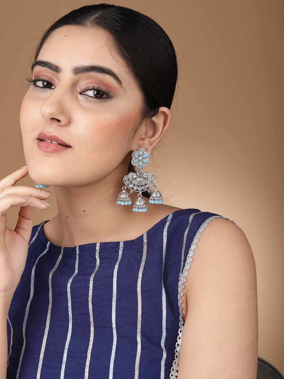 

Rubans Silver-Toned & Turquoise Blue Contemporary Jhumkas Earrings