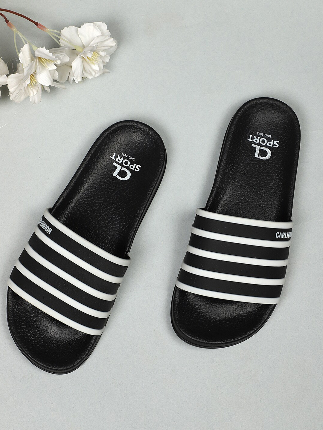 

Carlton London sports Women Black & White Striped Sliders