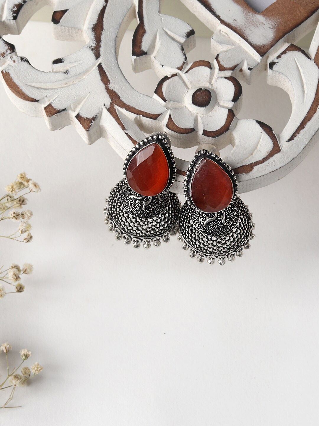 

TEEJH Woman Silver-Toned & Orange Stone Silver Oxidised Jhumka Earrings