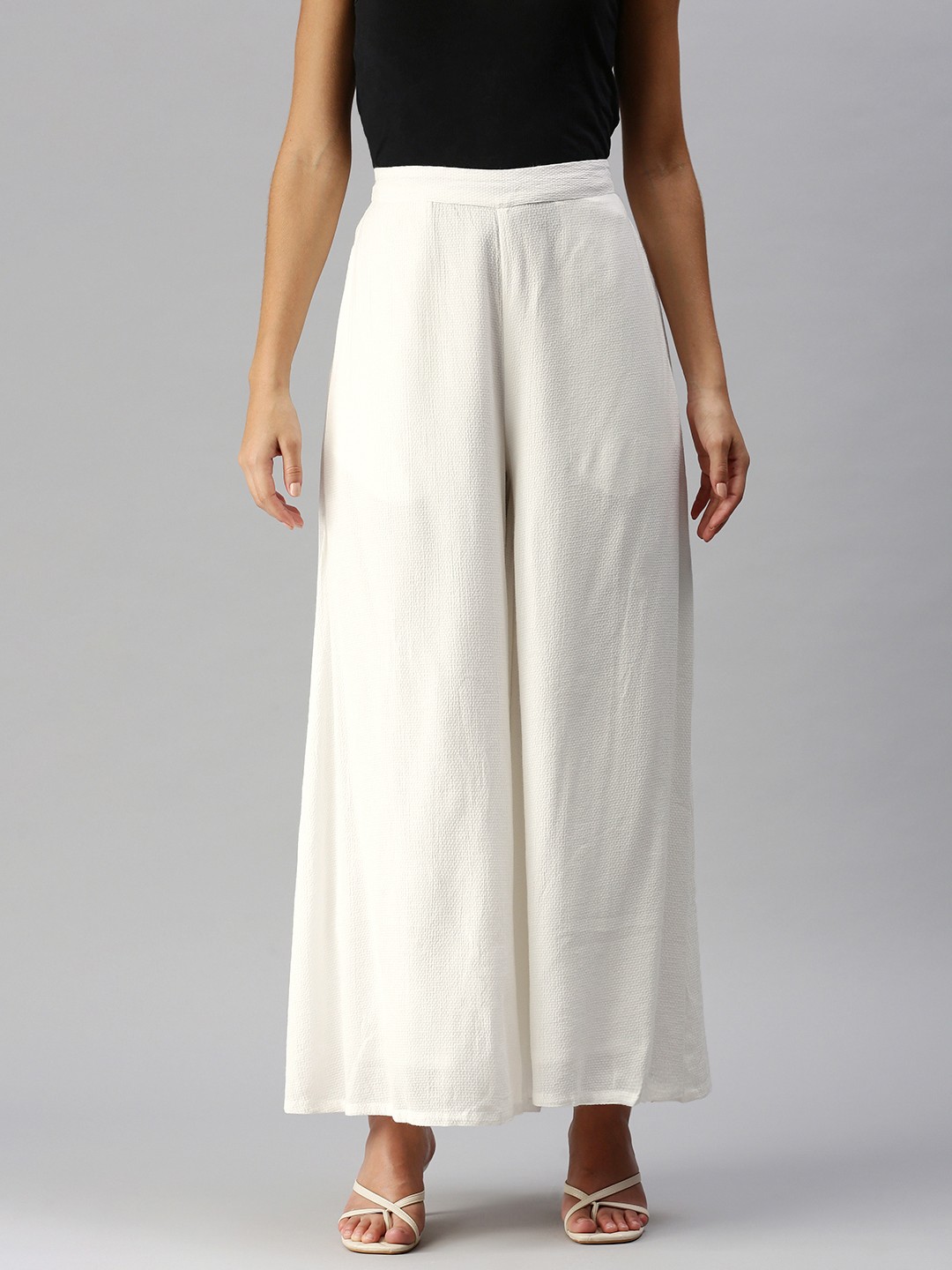 

Global Desi Women White Textured Trousers