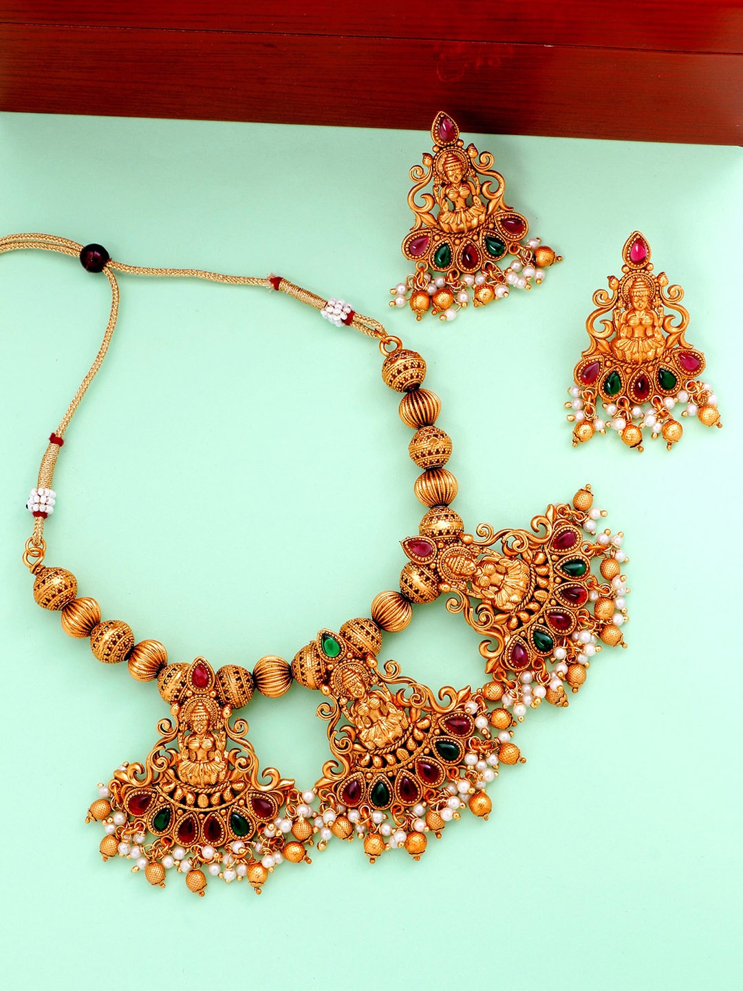 

aadita Gold-Plated White & Red Stone-Studded & Pearl Beaded Handcrafted Jewellery Set