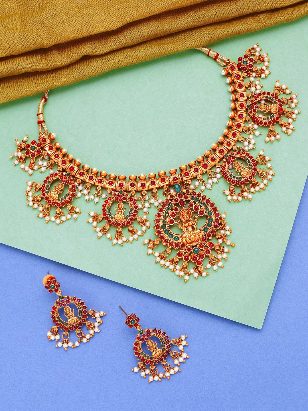 

aadita Gold-Plated White & Red Stone-Studded & Pearl Beaded Handcrafted Jewellery Set