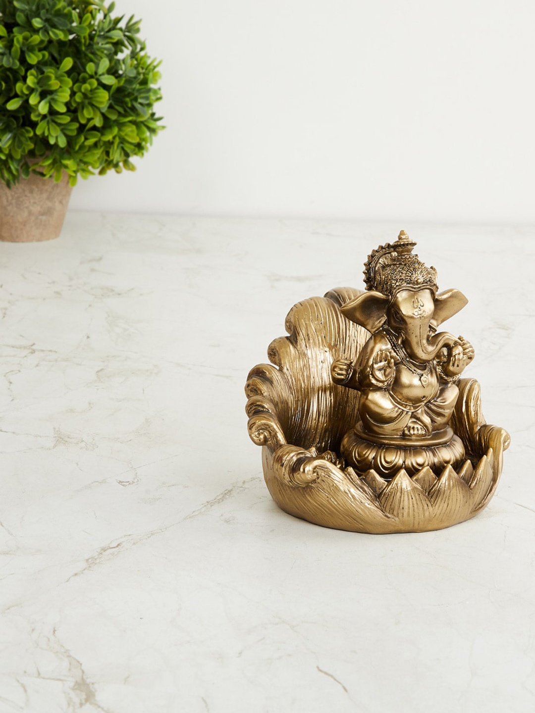 

Home Centre Gold Toned Corsica Ganesha Incense Holder Figurine