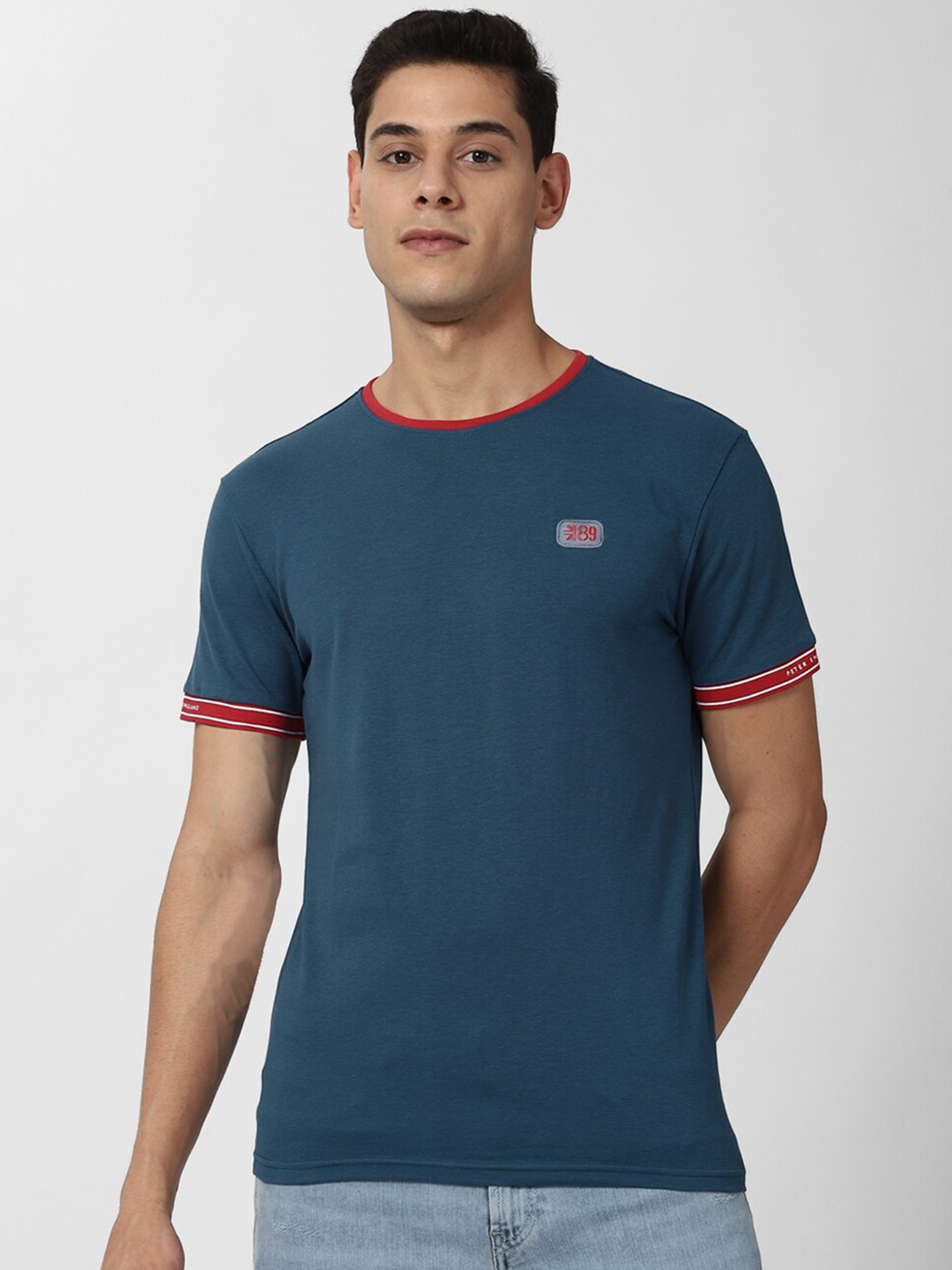 

Peter England Casuals Men Blue Solid Cotton T-shirt