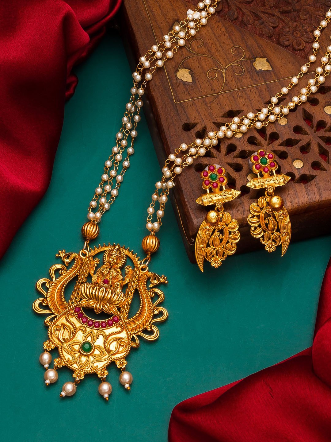 

aadita Gold Plated Pink & Green Stone Studded & White Pearl Beaded Temple Jewellery Set