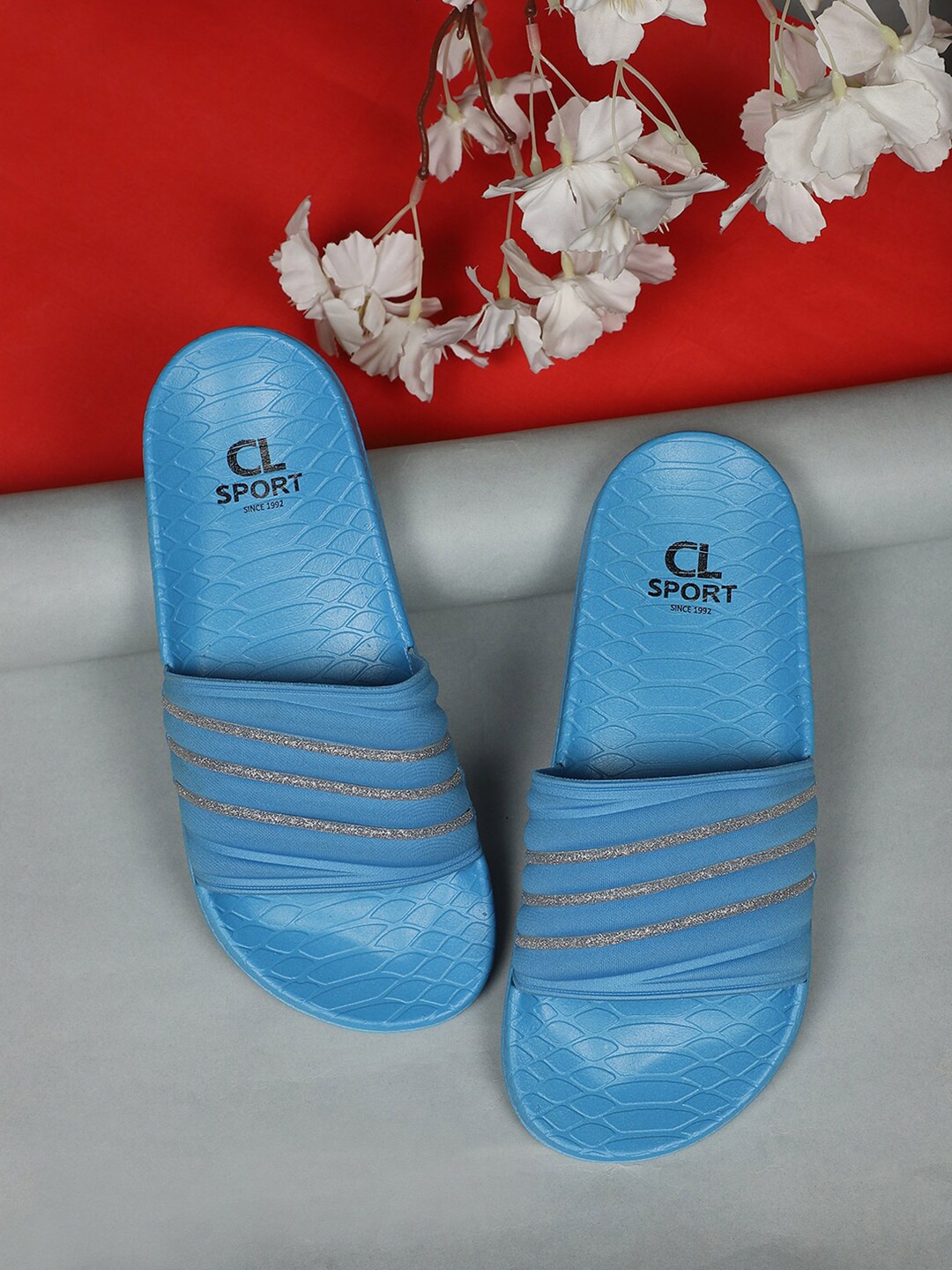 

Carlton London sports Women Blue & Gold-Toned Striped Sliders