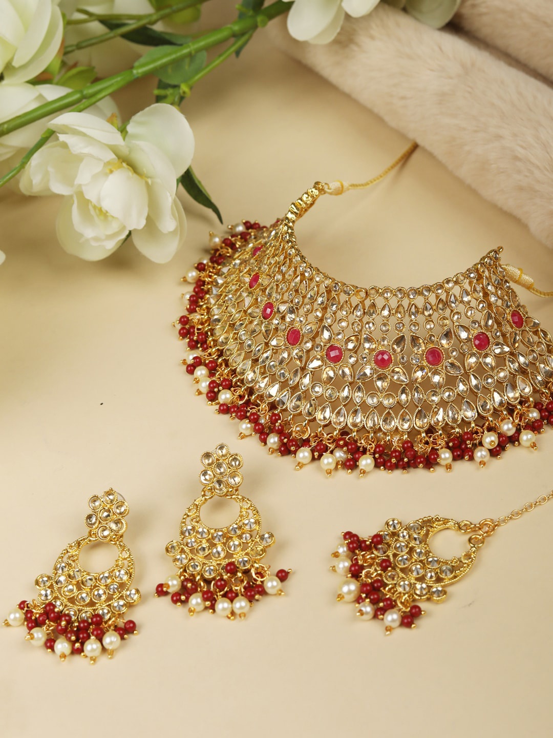 

Priyaasi Gold-Plated White & Red Stone Studded Handcrafted Jewellery Set