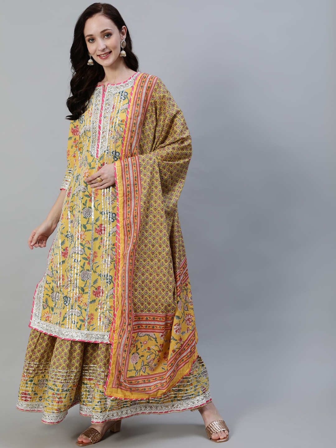 

Ishin Women Yellow Floral Printed Regular Gotta Patti Pure Cotton Kurta with Skirt & With Dupatta