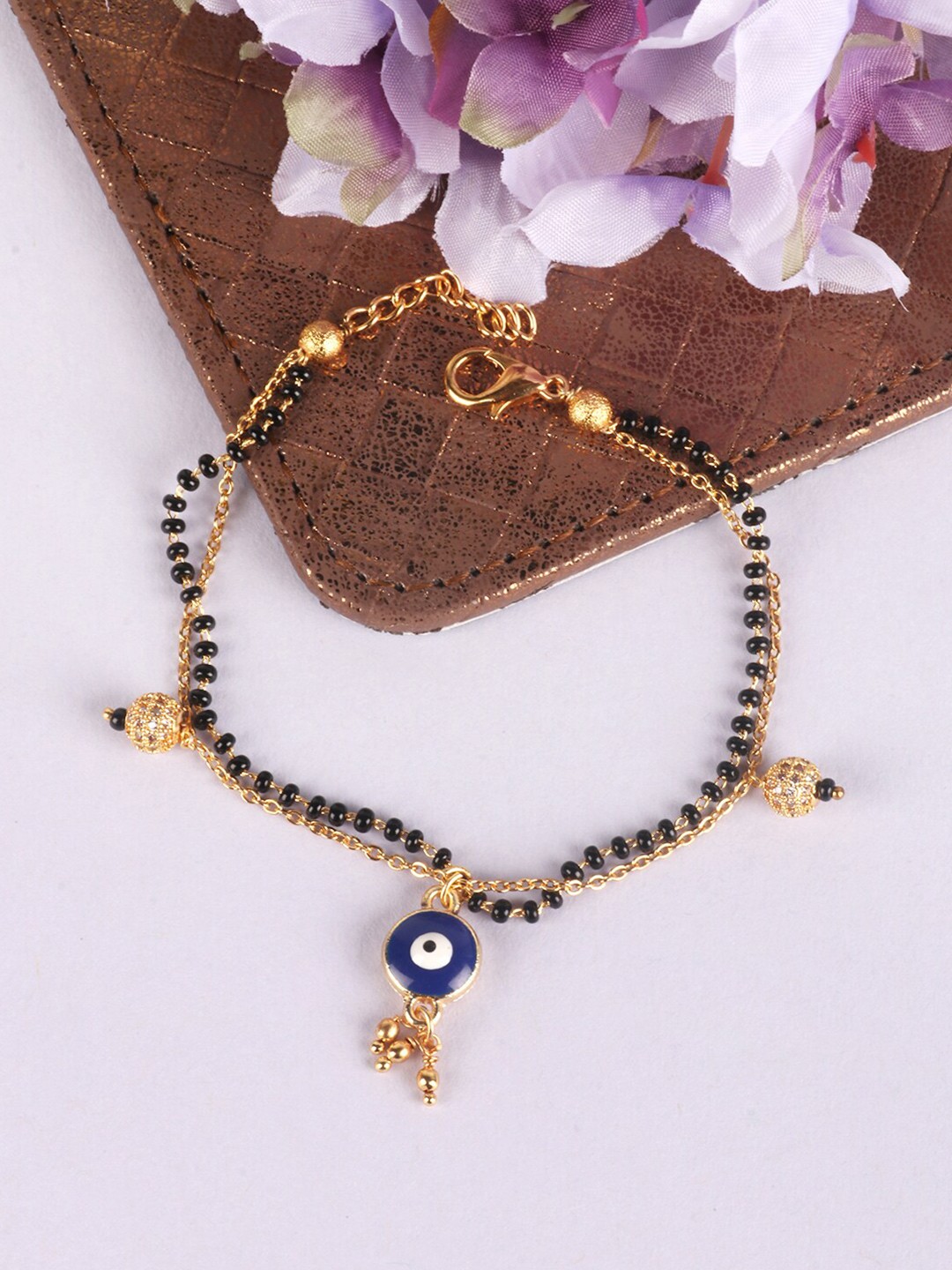 

PENNY JEWELS Women Gold-Toned & Blue Gold-Plated Evil Eye Charm Bracelet