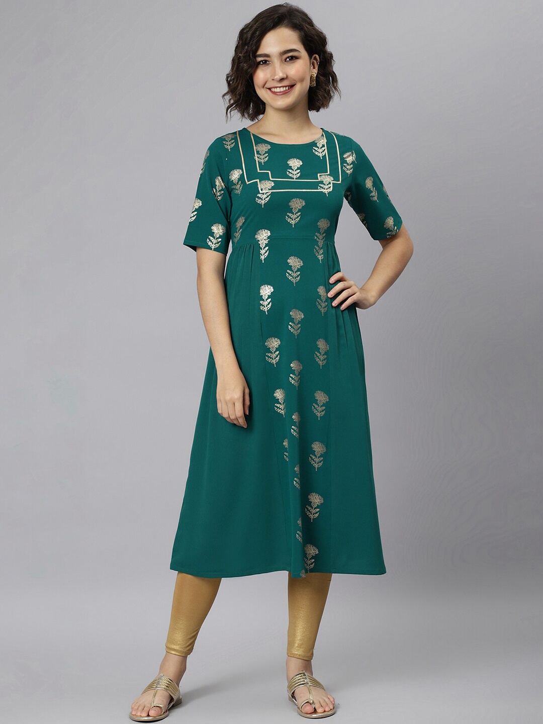 

Janasya Women Teal Geometric Embellished Cotton Kurta