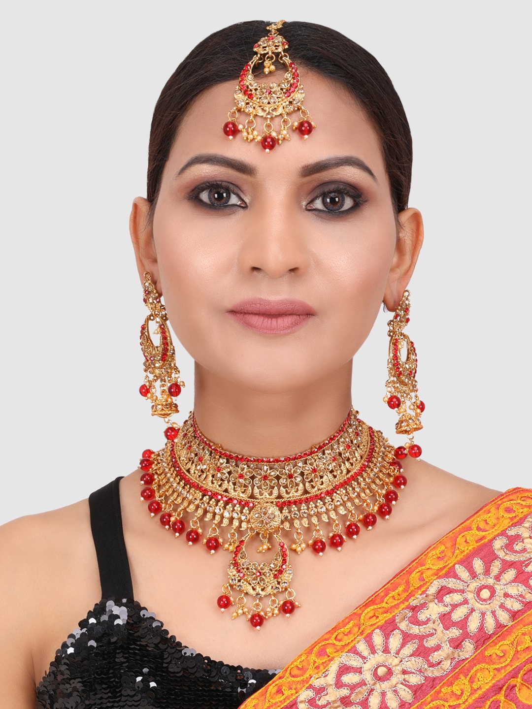 

PENNY JEWELS Gold Toned & Red Brass Gold Plated Choker Set With Earrings & Maangtika