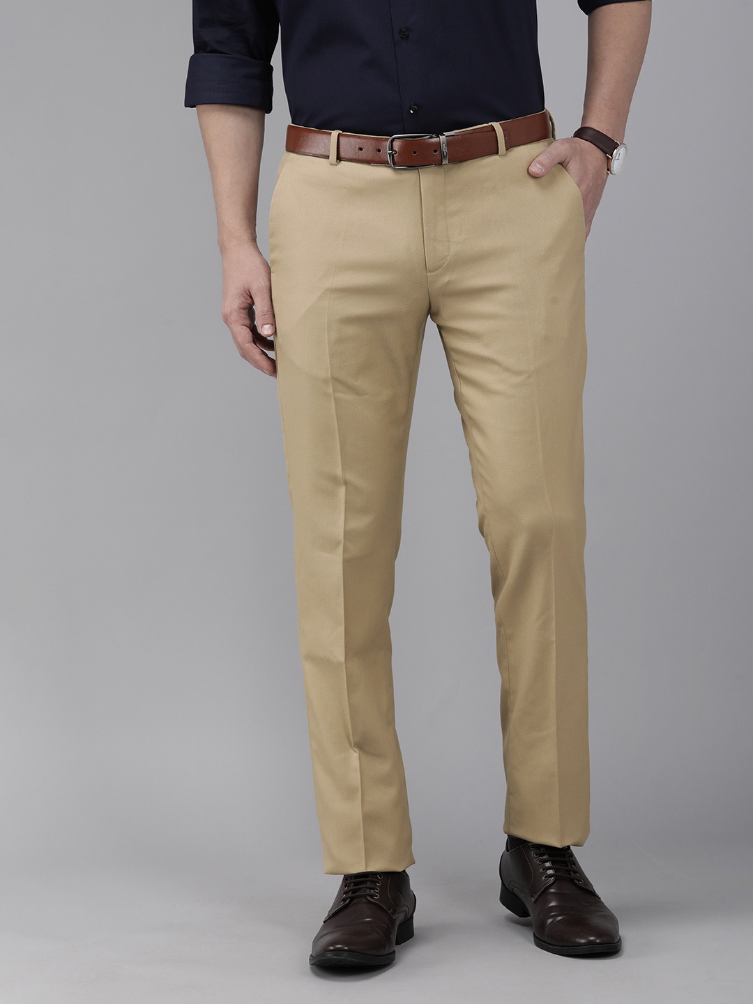 

Arrow Men Beige Solid Tapered Fit Trousers
