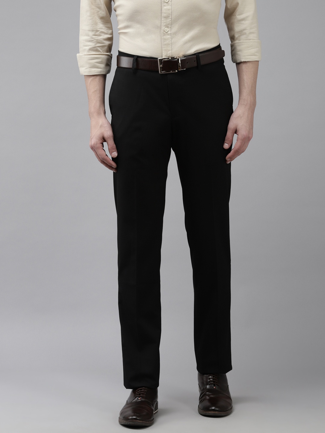 

Arrow Men Black Solid Tapered Fit Trousers