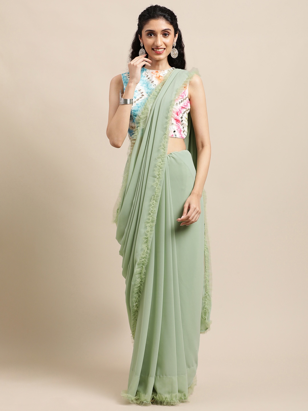 

EthnoVogue Mint Green Solid Art Silk Saree