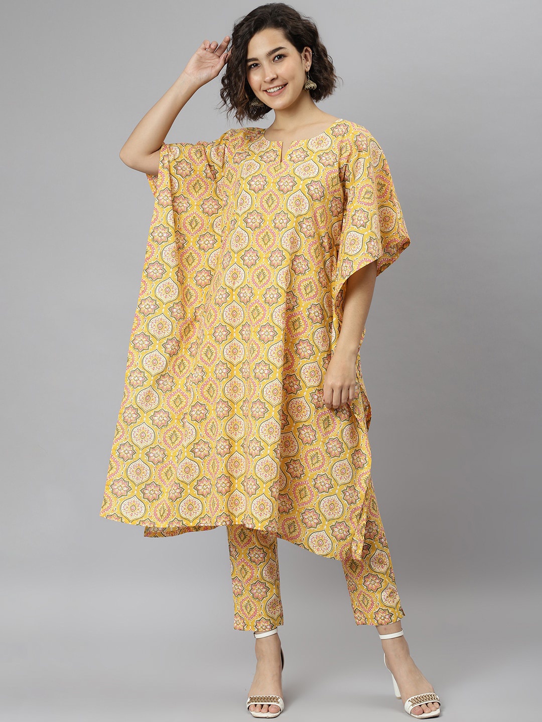 

Janasya Women Yellow Ethnic Motifs Printed Regular Pure Cotton Kurta with Trousers