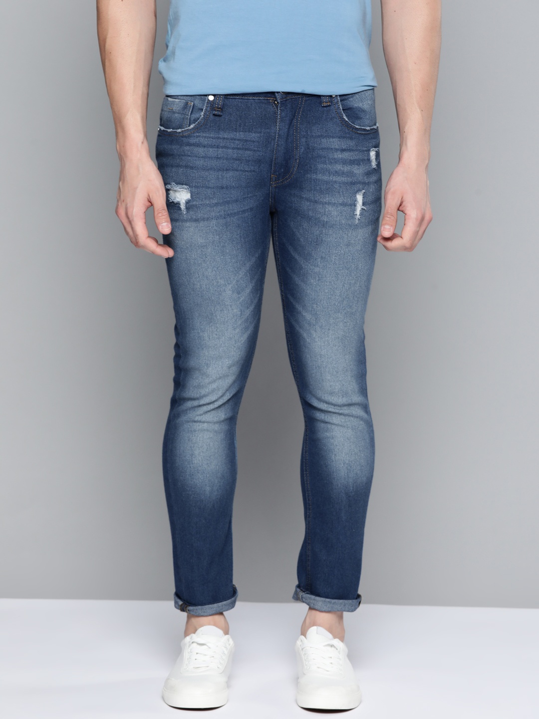 

Mast & Harbour Men Blue Skinny Fit Mildly Distressed Light Fade Stretchable Jeans