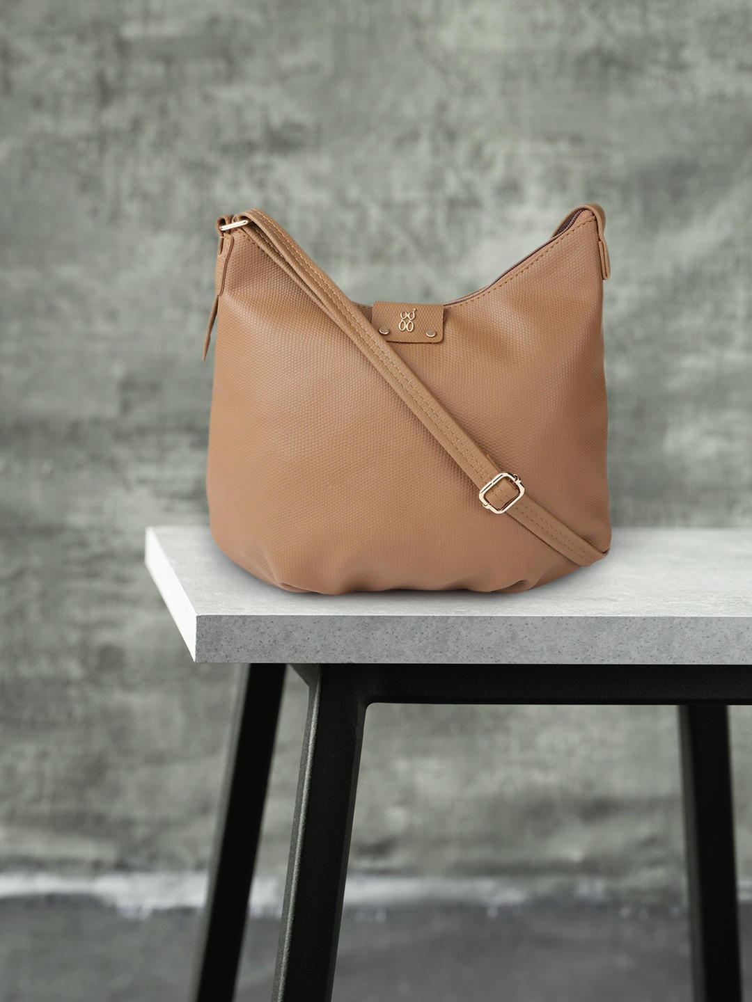 

Baggit Brown Textured Sling Bag