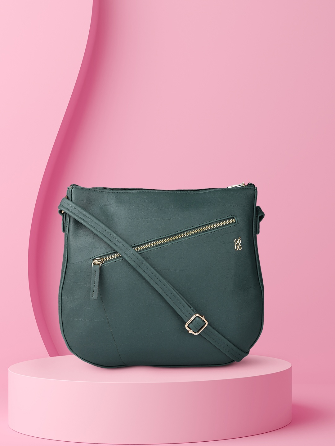 

Baggit Green Solid Synthetic Regular Structured Sling Bag