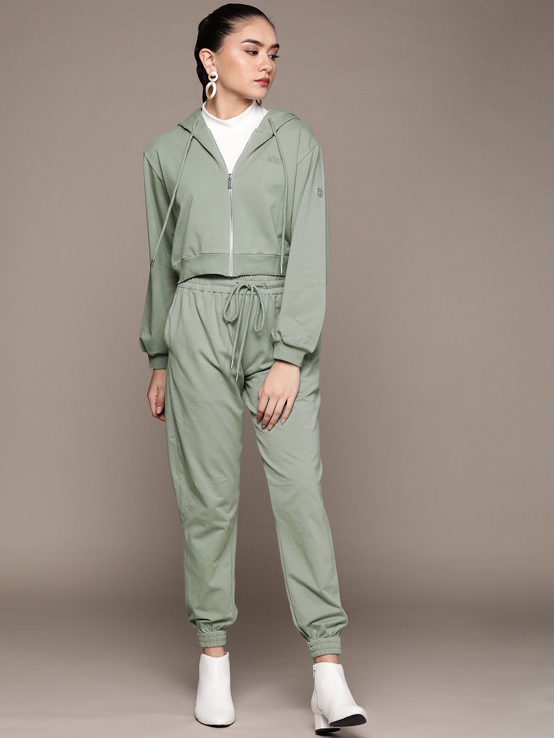 

aarke Ritu Kumar Women Green Solid Track Suit