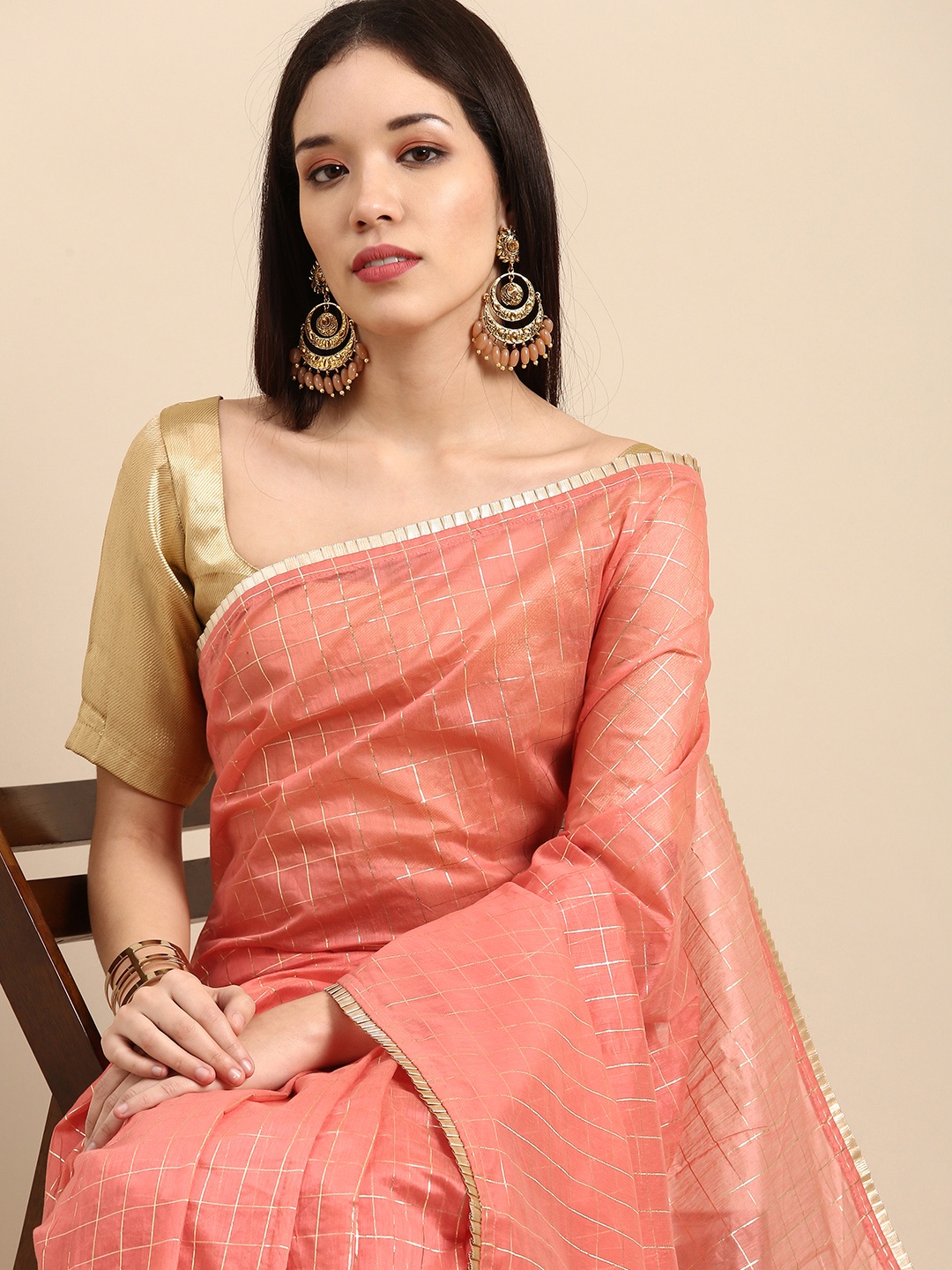 

Sangria Peach-Coloured & Gold-Toned Checked Zari Saree