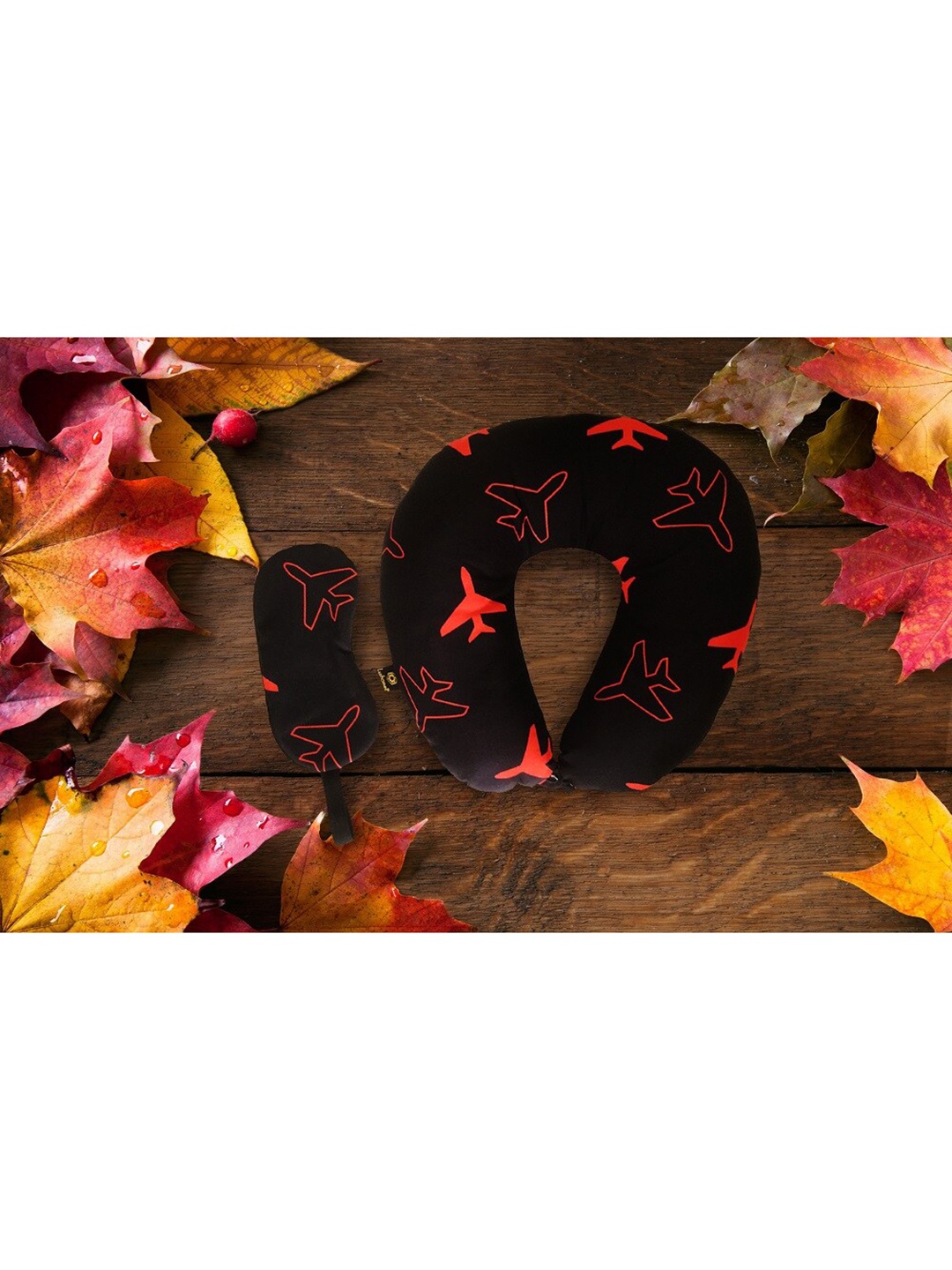 

Lushomes Black Printed Polyester Filled Neck Pillow with Button and Coordinating Eyemask.