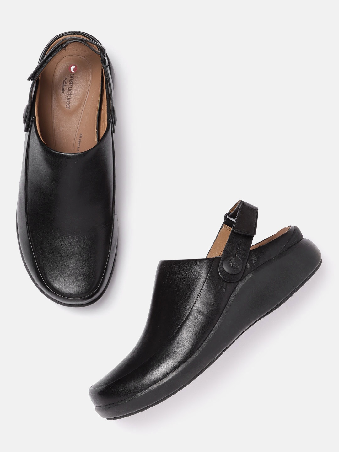 

Clarks Women Black Solid Leather Clogs