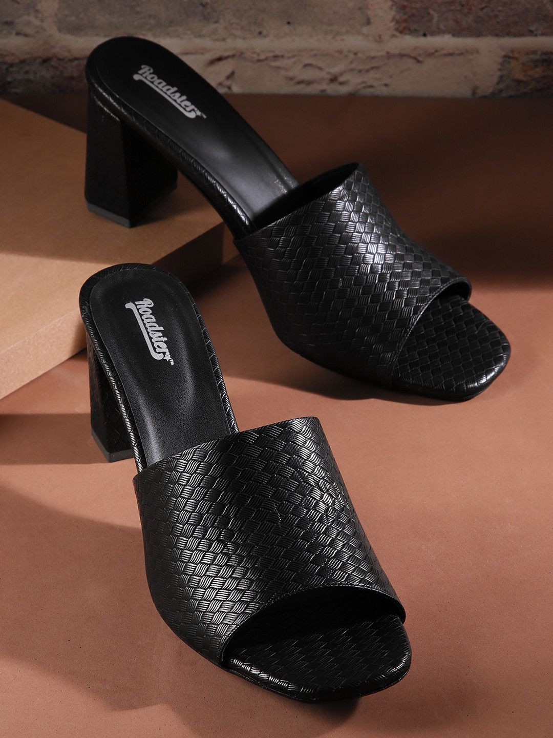 

Roadster Women Black Textured Block Heel Sandals