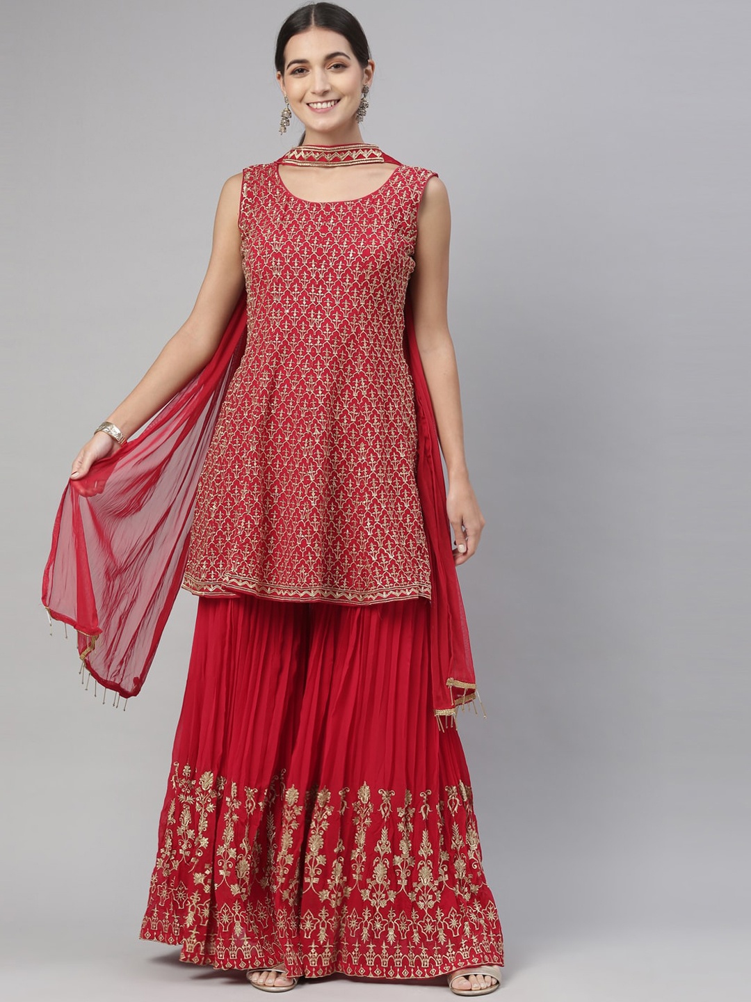 

Neerus Women Pink Ethnic Motifs Embroidered Empire Thread Work Silk Georgette Kurti with Skirt & With