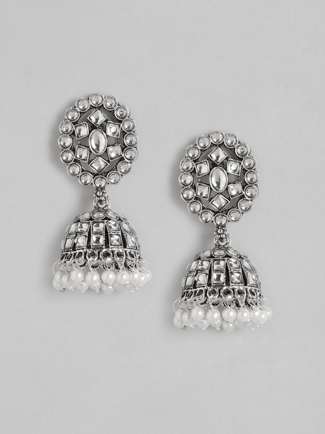 

Anouk Silver-Toned & White Oxidised Kundan Studded & Beaded Dome Shaped Jhumkas