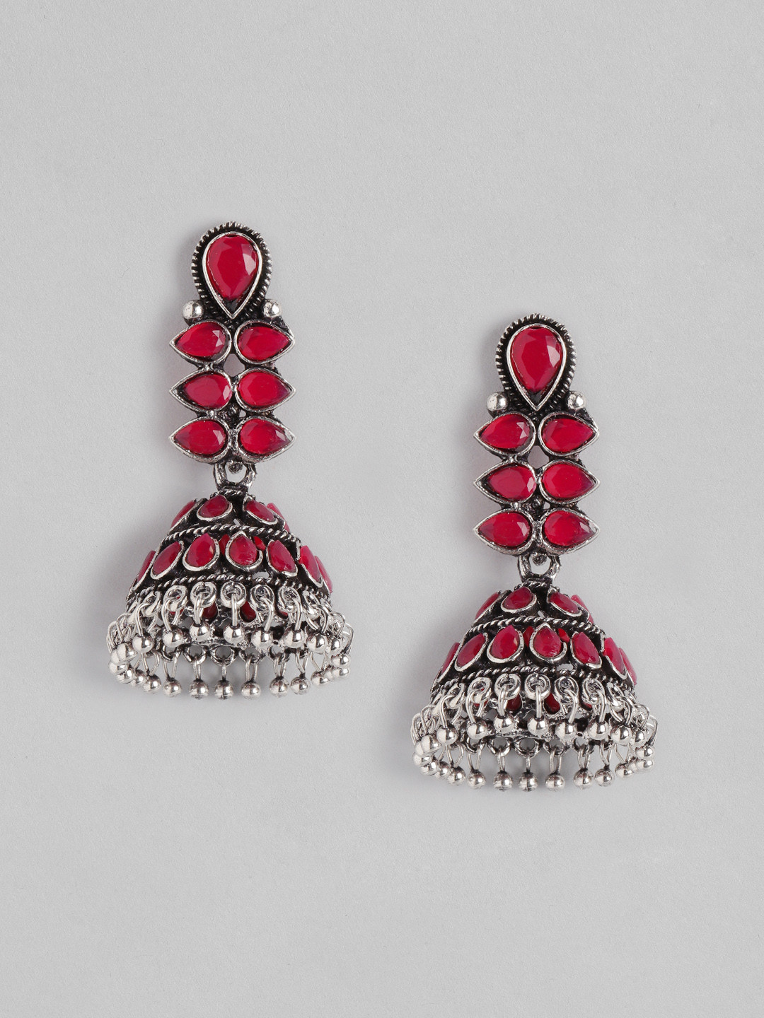 

Anouk Oxidised Silver-Toned & Red Stone Studded Dome Shaped Jhumkas Earrings