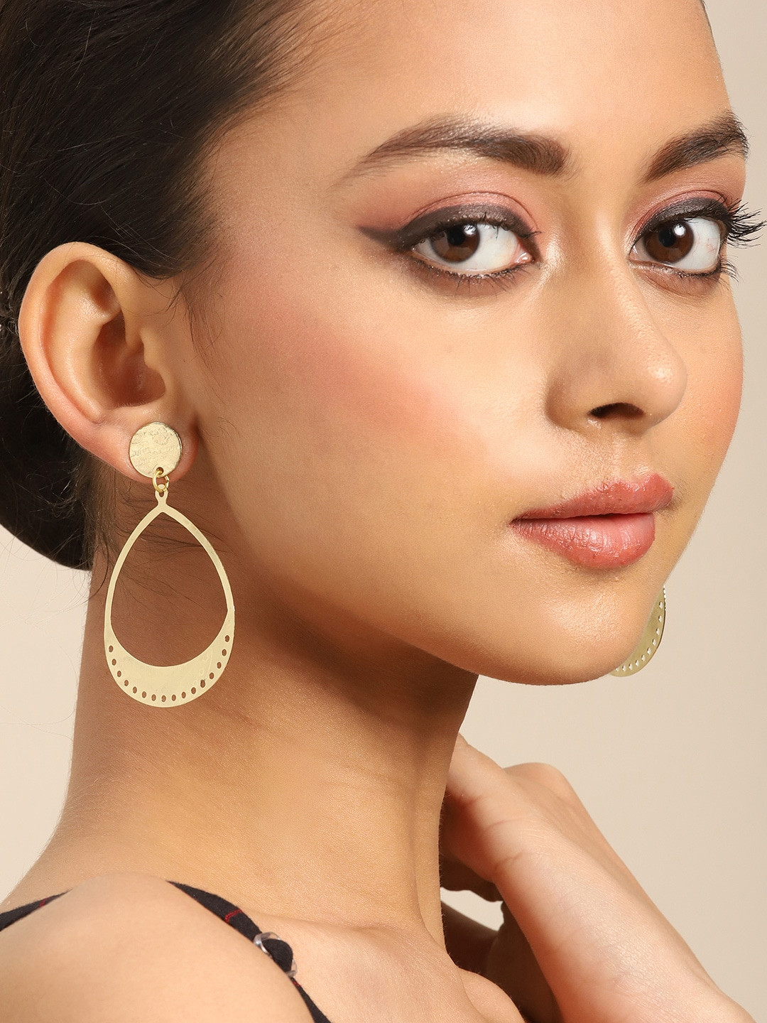 

Anouk Gold-Toned Solid Teardrop Shaped Earrings