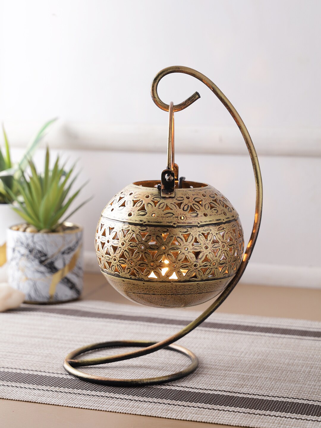

Aapno Rajasthan Copper-Toned Textured Metal Candle Holder