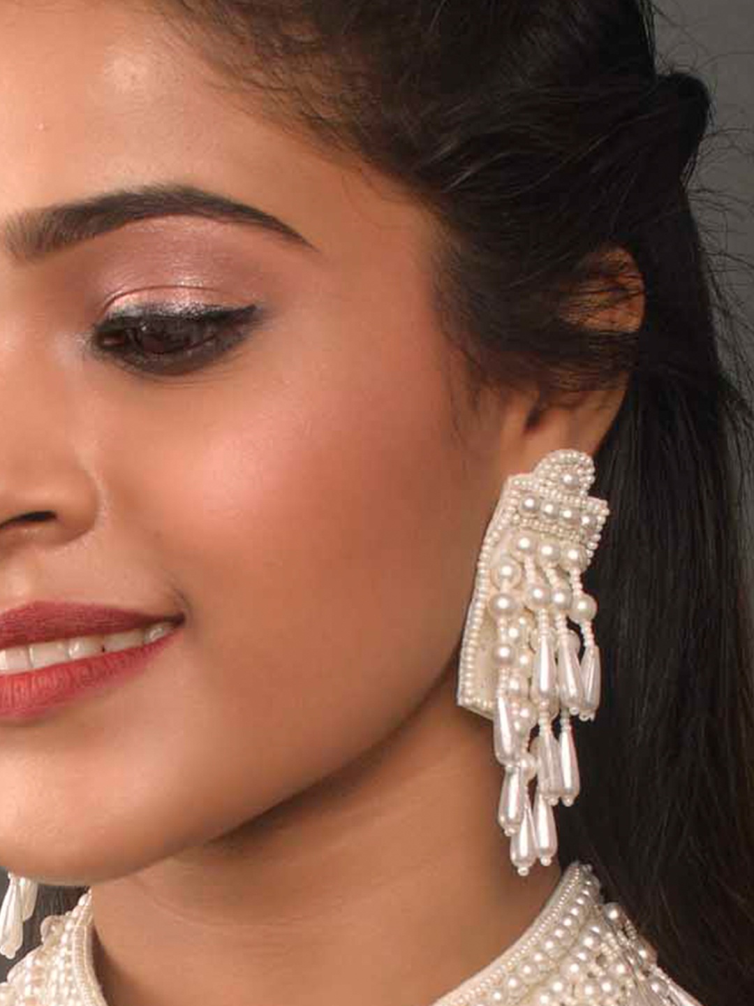 

Fida White Contemporary Drop Earrings