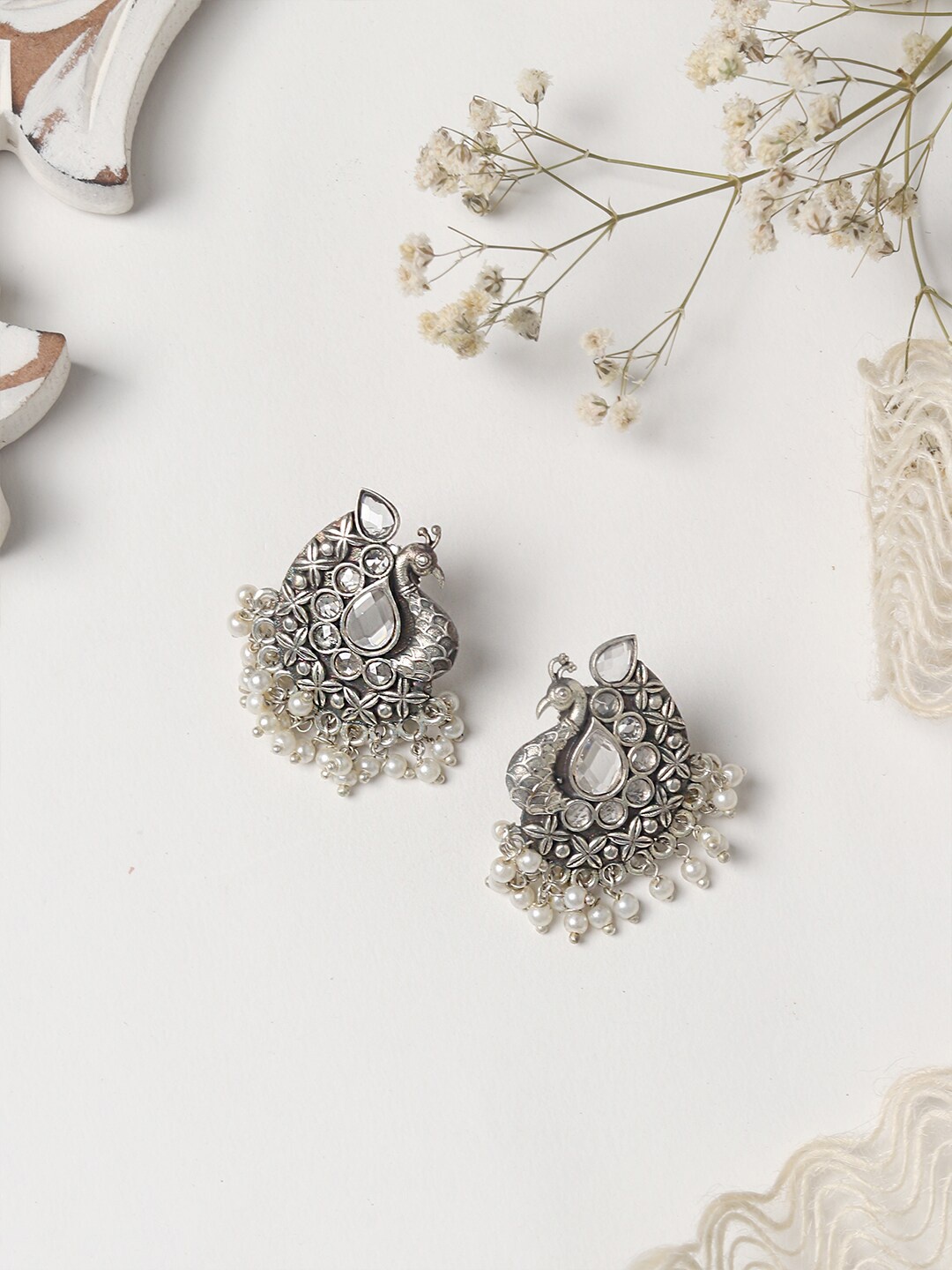 

TEEJH Silver-Toned & White Stones & Pearls Studded Oxidised Contemporary Studs Earrings