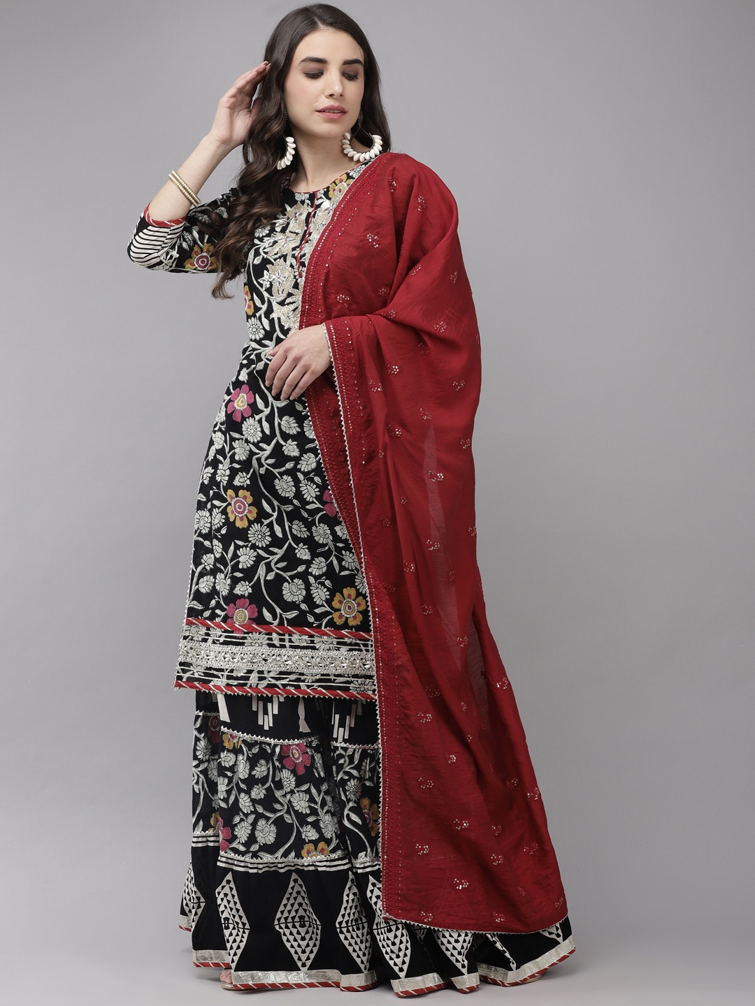 

Ishin Women Black Floral Embroidered Regular Gotta Patti Kurta with Sharara & With Dupatta