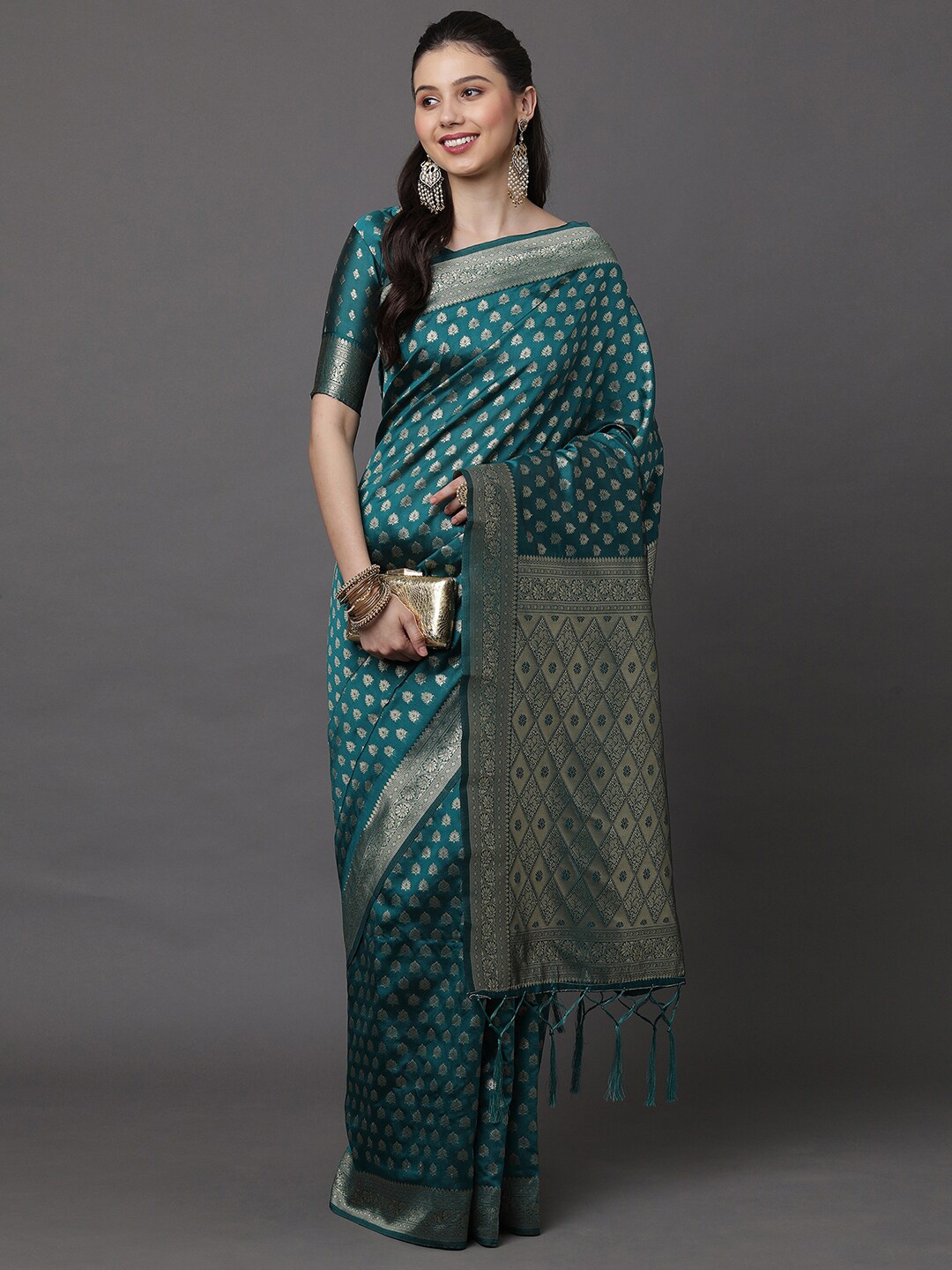 

Mitera Teal & Gold-Toned Ethnic Motifs Zari Banarasi Silk Blend Saree