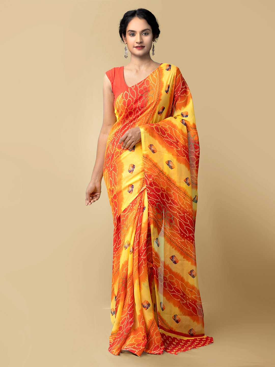 

Unnati Silks Women Orange & Yellow Printed Georgette Saree