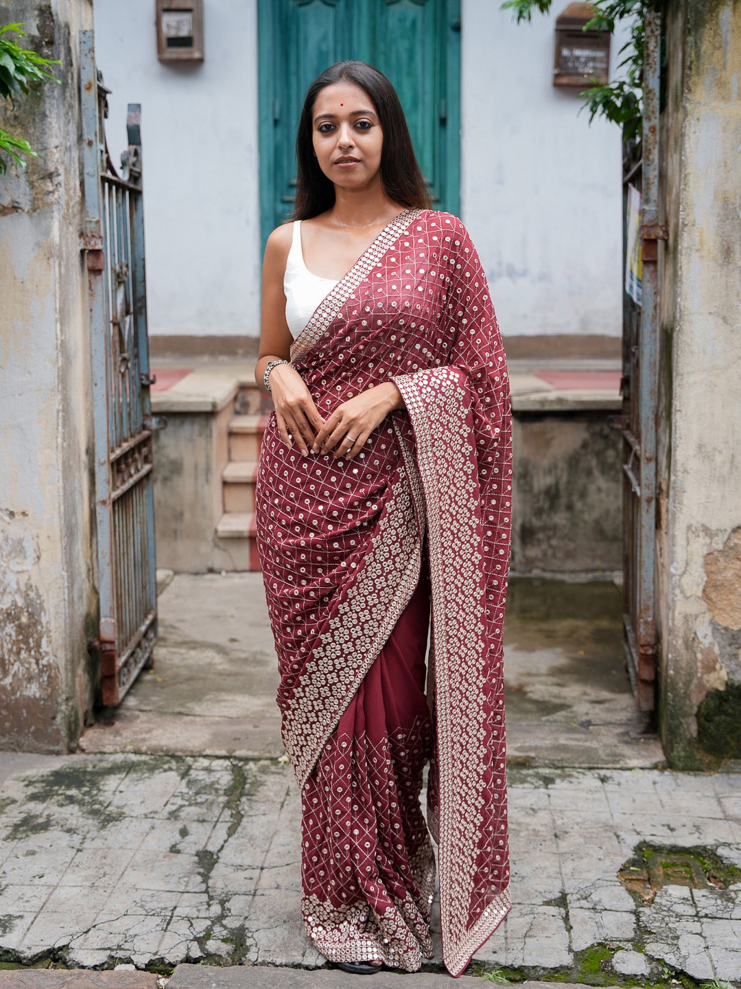 

Suta Maroon & Silver Embellished Saree