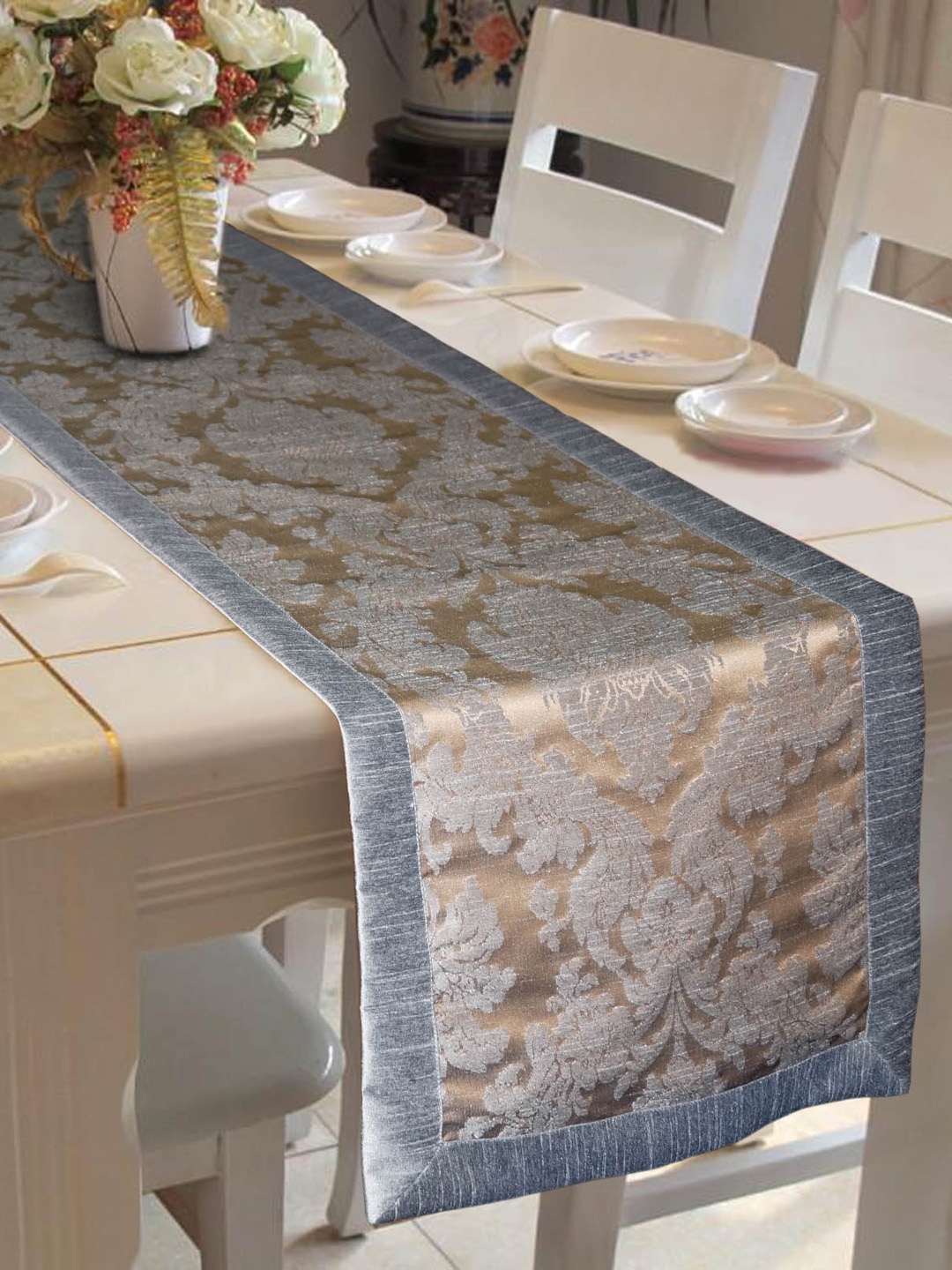 

Lushomes Grey & Gold-Coloured Self-Design Jacquard Table Runner