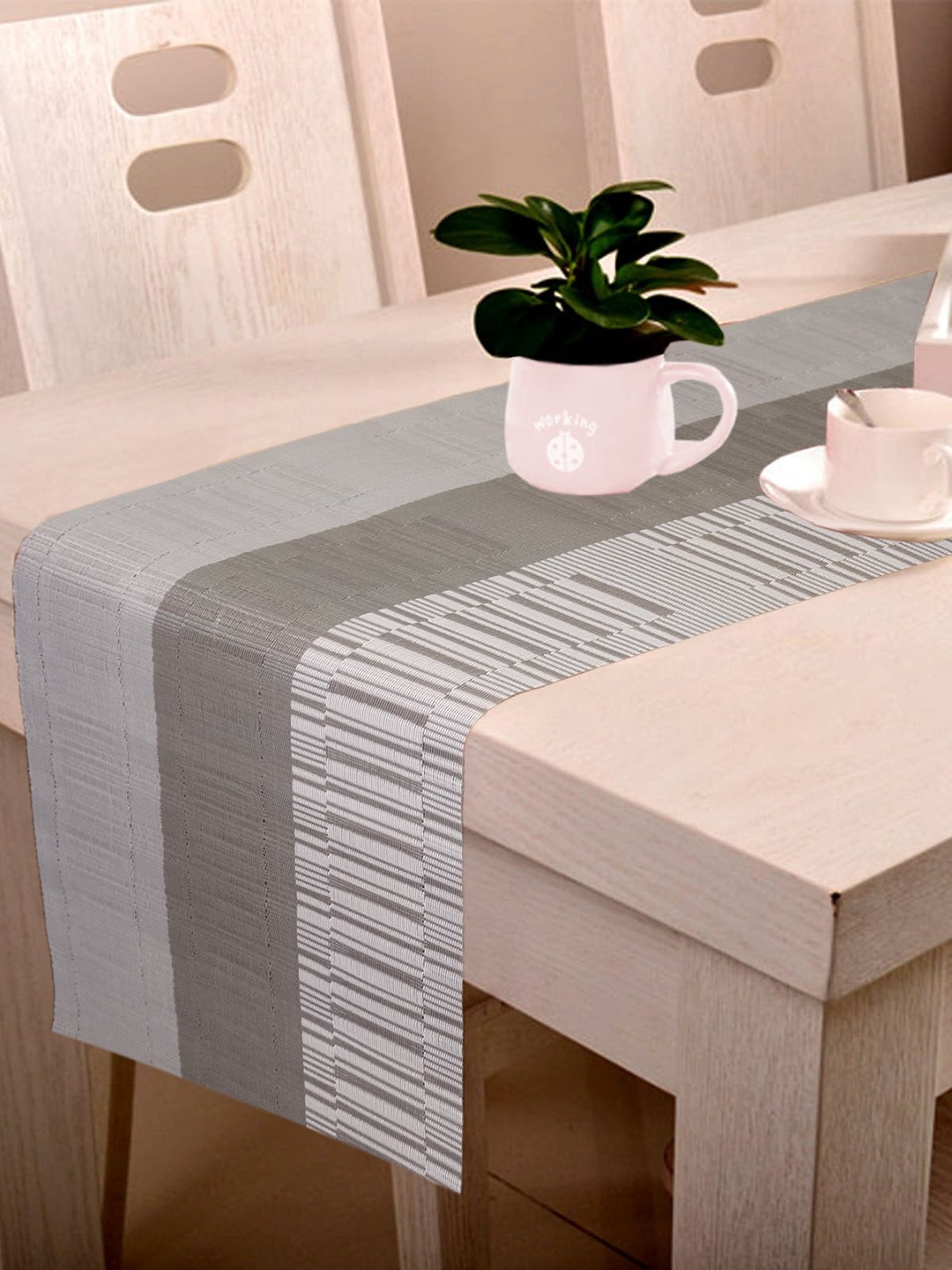 

Lushomes Grey Self-Design Plastic Table Runner