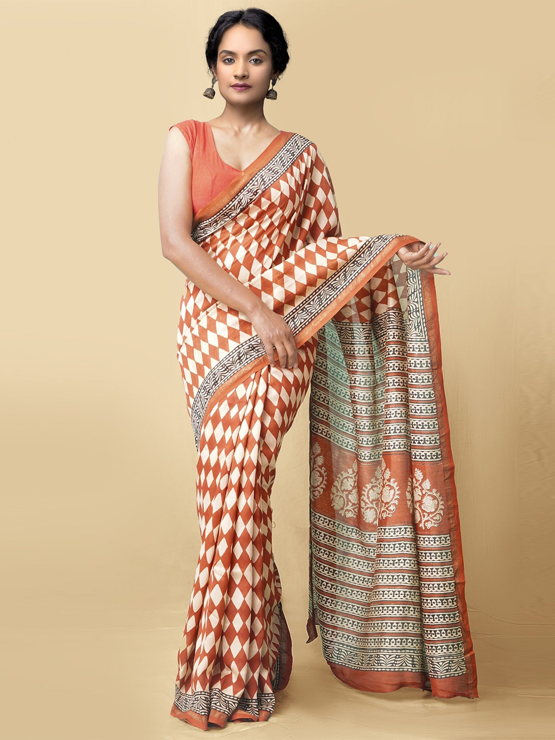 

Unnati Silks Women Rust & White Pure Preet Bagru Chanderi Sico Saree