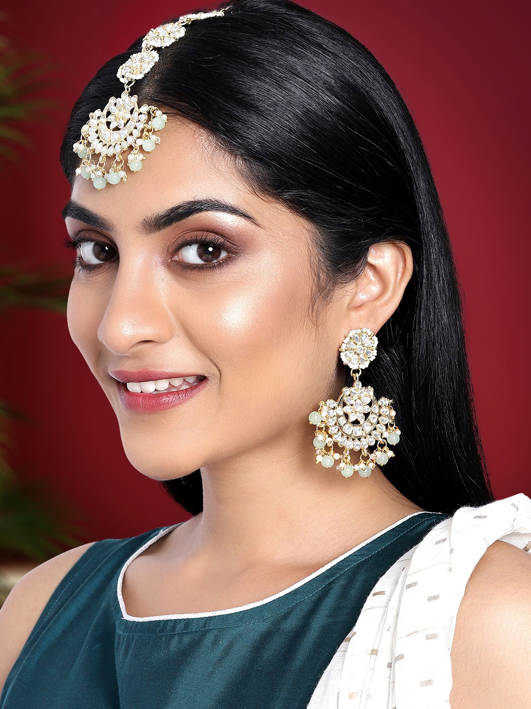 

Peora Sea Green Gold Plated Kundan Pearl Studded Chandbali Earrings & Maang Tika