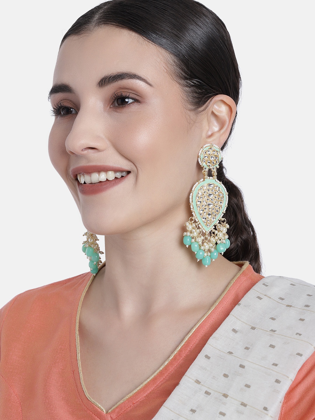 

Peora Sea Green & White Gold Plated Teardrop Shaped Kundan Pearls Studded Drop Earrings